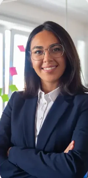 Confident latin business leader portrait young businesswoman suit glasses posing with arms folded looking camera smiling female leadership concept@2x