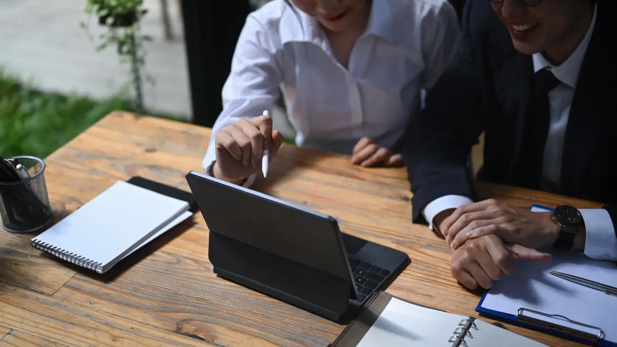 Business colleagues working together using a table 2026 03 15 23 30 02 utc